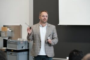 Martin Bulst from Sciospec lecturing on impedance analysis and practical measurement methods at IWIS 2025